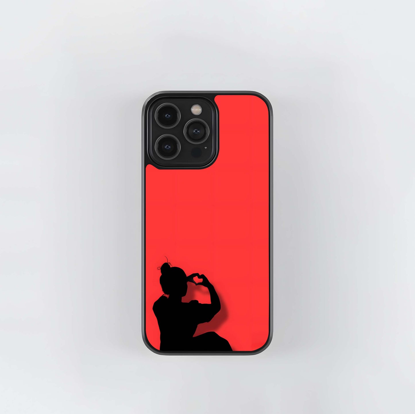 Silhouette Heart Hand Sign on Vibrant Red Glass Case