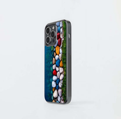 Colorful river stones and grass Glass Case