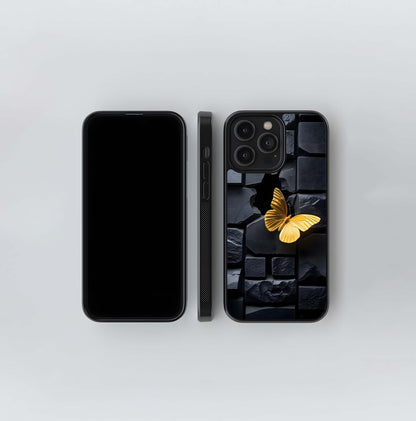 Golden Butterfly on Cracked Black Stone Wall Glass Case