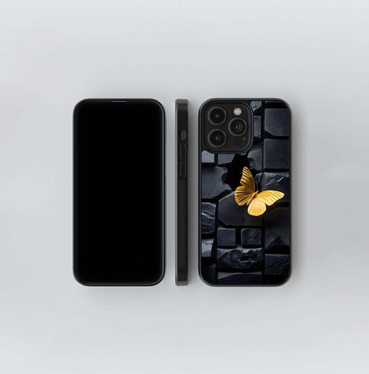 Golden Butterfly on Cracked Black Stone Wall Glass Case